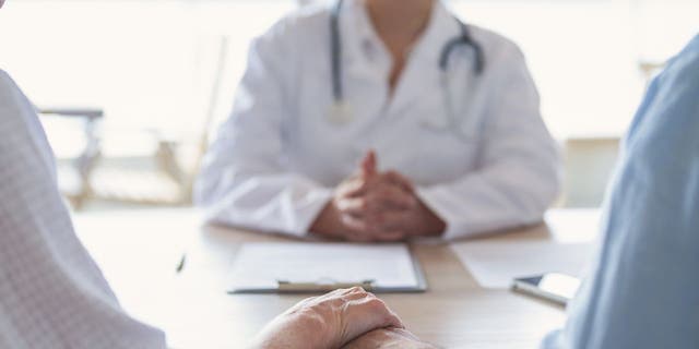 Couple meeting with doctor